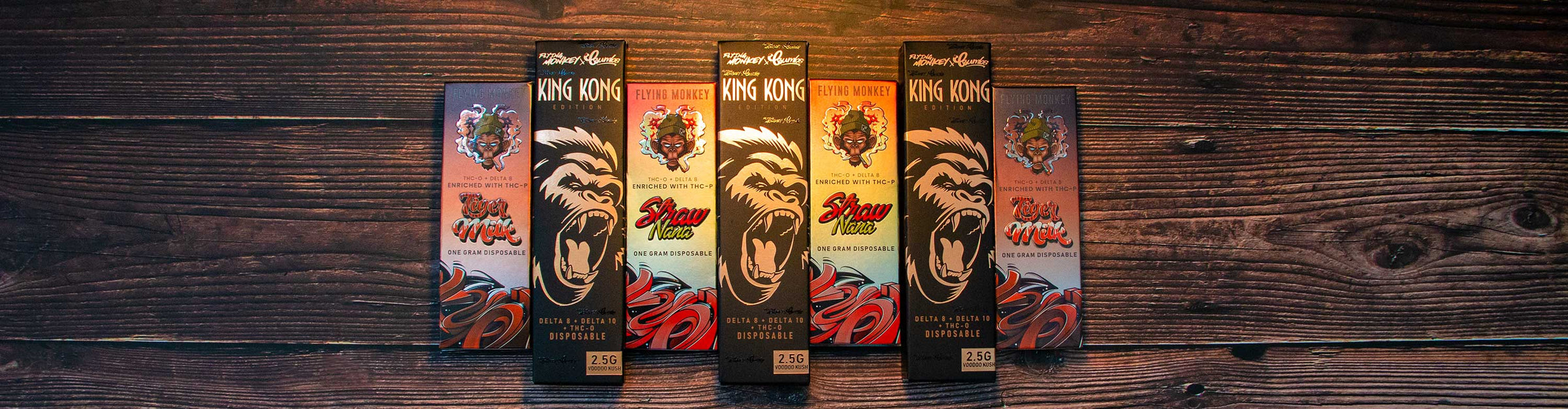 Flying Monkey Products laying down on wooden table with spotlight