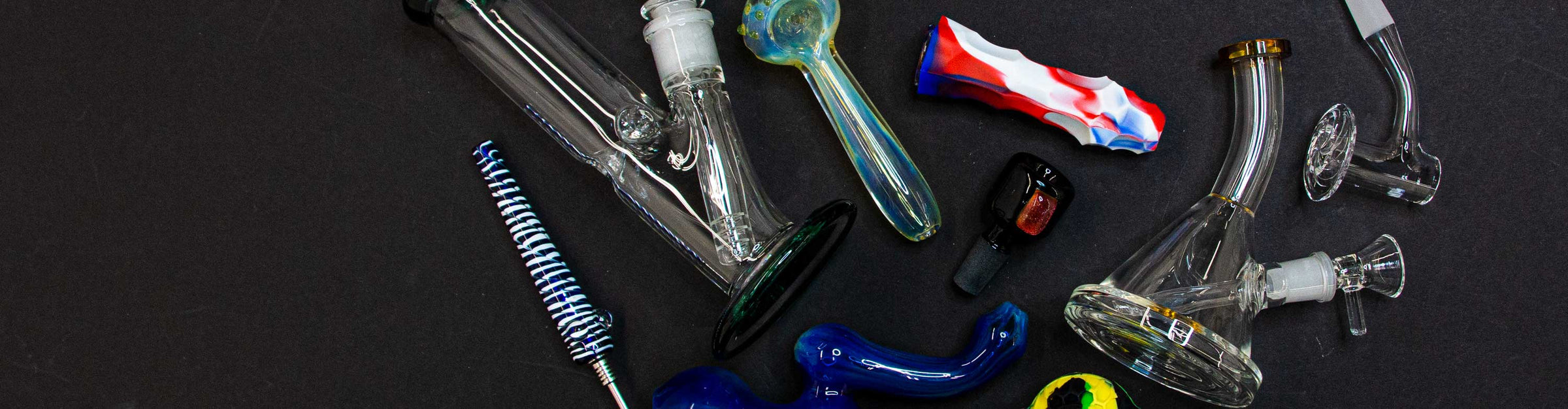 Got Vape Glass Distro various glass products laying down on black background
